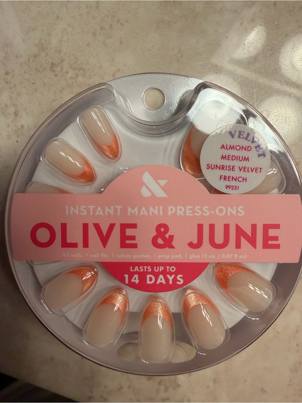 Olive & June Almond Press-On Nails in Cream with Orange Tips